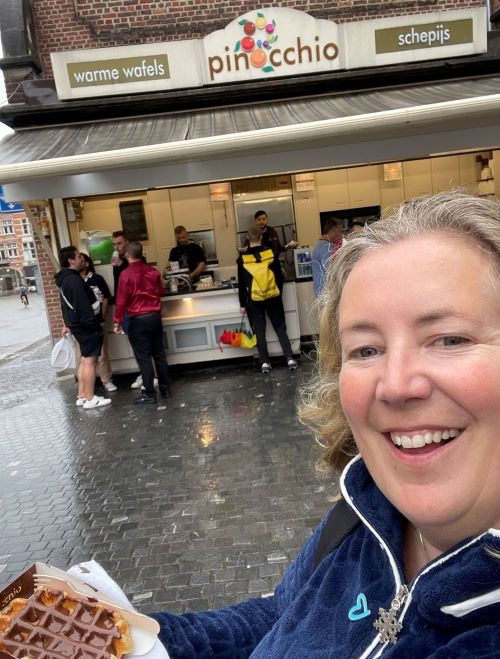 A student enjoys a waffle in Belgium.